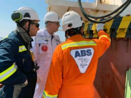 ABS Chairman, President and CEO, Christopher J. Wiernicki on board a vessel with ABS surveyors.