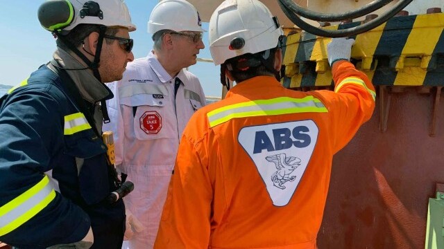 ABS Chairman, President and CEO, Christopher J. Wiernicki on board a vessel with ABS surveyors.